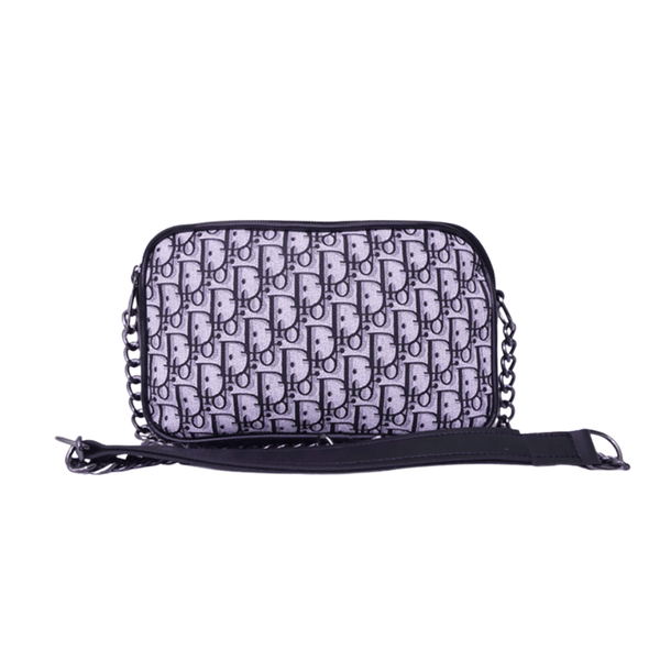 Luxury inspired Antaaj crossbody bag with faux feather material, long chain strap, and dual zipper compartments.