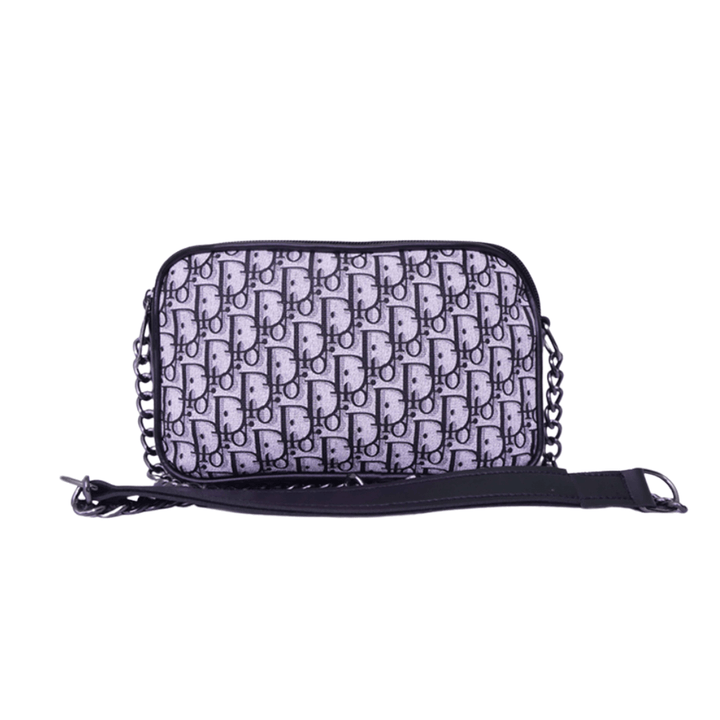 Luxury inspired Antaaj crossbody bag with faux feather material, long chain strap, and dual zipper compartments.