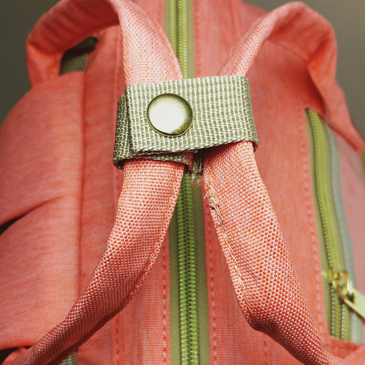 Highly organized Antaaj diaper backpack with multiple compartments, bottle holders and back access zipper.