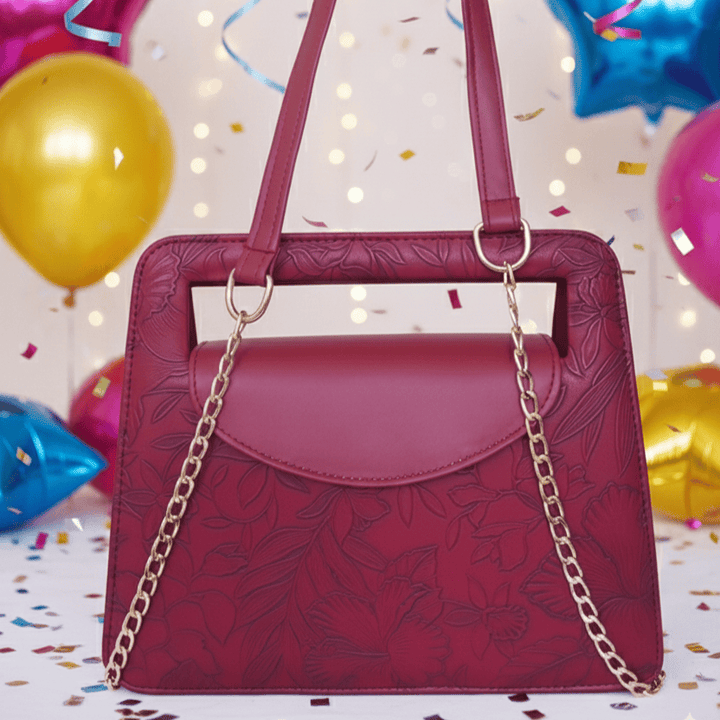 Elegant Antaaj faux leather shoulder bag with a delicate imposed floral design and a chic gold-tone chain strap.