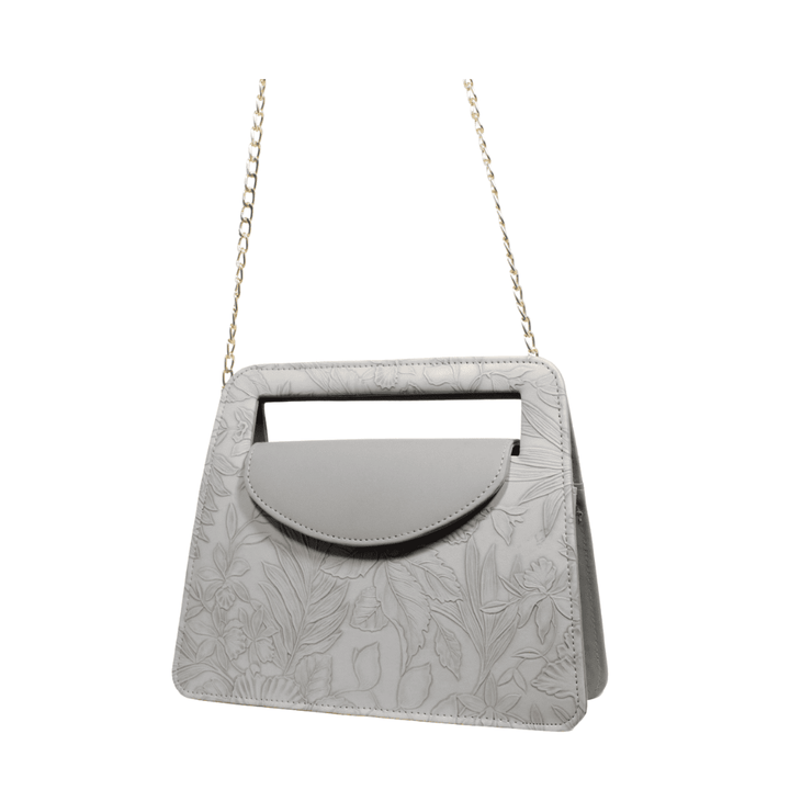 Elegant Antaaj faux leather shoulder bag with a delicate imposed floral design and a chic gold-tone chain strap.