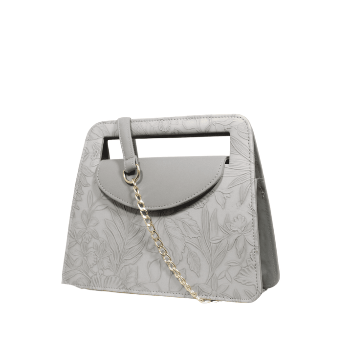 Elegant Antaaj faux leather shoulder bag with a delicate imposed floral design and a chic gold-tone chain strap.