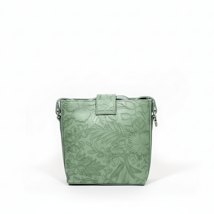 Modern Antaaj crossbody bag with floral print, long strap, metal twist lock closure, and back slip pocket.