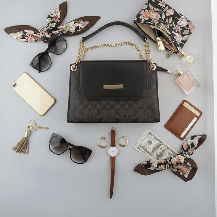 Elegant Antaaj plain faux leather crossbody bag with a long chain strap and magnetic flap closure.