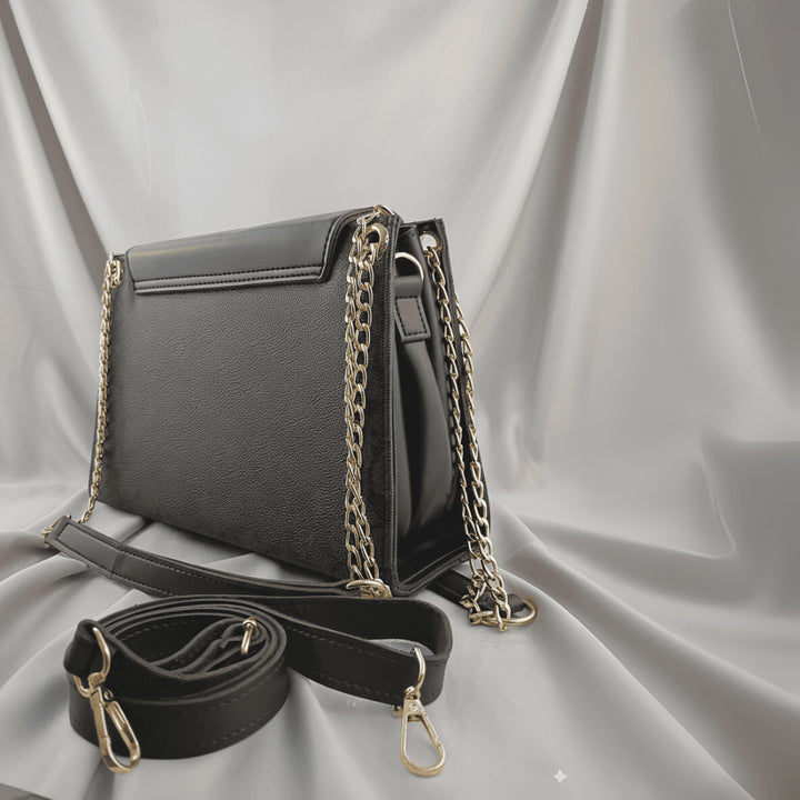 Elegant Antaaj plain faux leather crossbody bag with a long chain strap and magnetic flap closure.